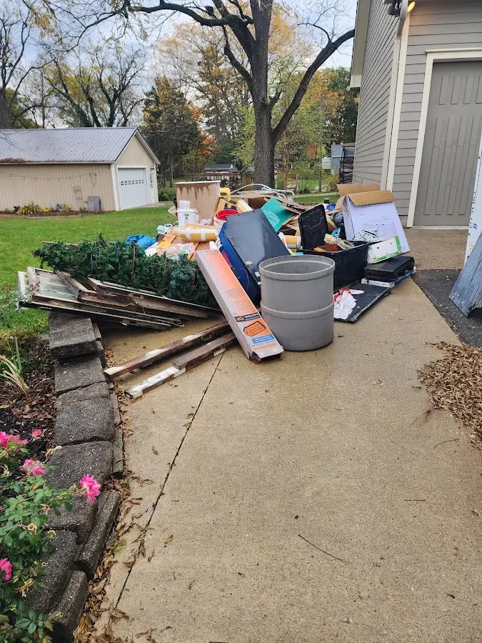 Dumpster being loaded with debris for Demolition Dumpster Rental in Elmira Heights